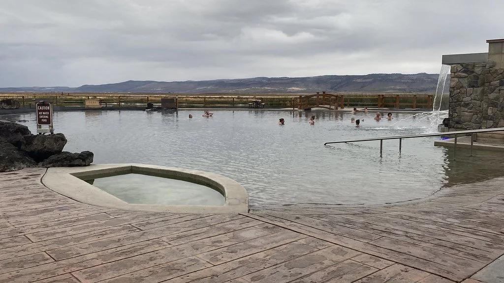 Outdoor mineral-water pond and deck at Crane Hot Springs (archive photograph)