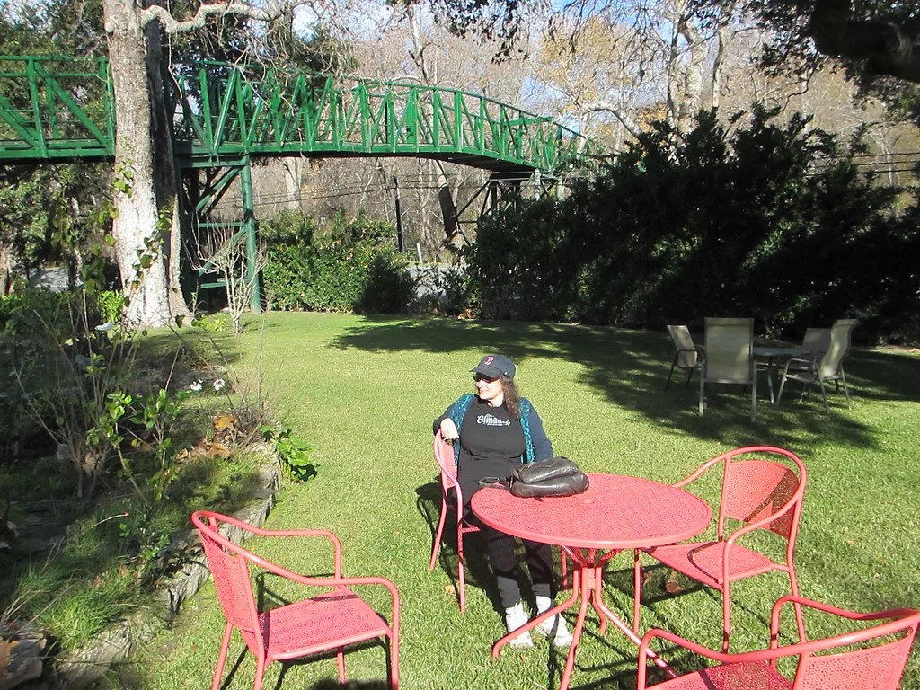 Garden seating and green bridge at Sycamore Mineral Springs (archive photograph)