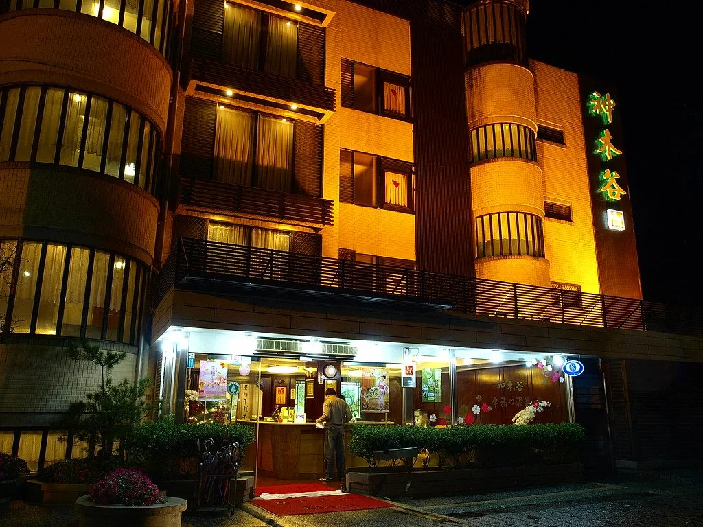 Utopia Holiday Hotel building and entrance at night (archive photograph)